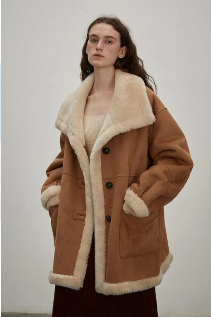 double-sided shearling coat, reversible winter jacket, tailored shearling outerwear, luxury cold-weather coat, minimalist timeless design, buttery-soft sheepskin, high-end winter staple